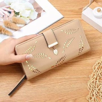 Beige long women wallet with gold hollow leaf pattern and snap button closure