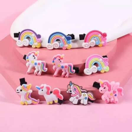 Cute 3D unicorn and rainbow hair clips for girls pack of 10 on pink background
