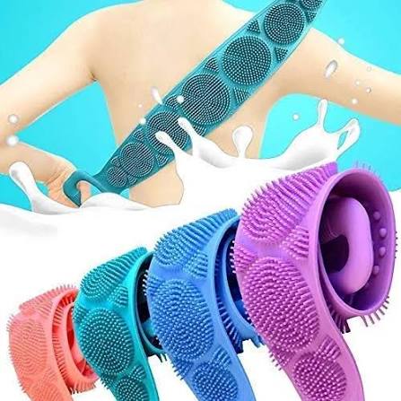 Silicone back scrubber bath belt being used on back with milk splash