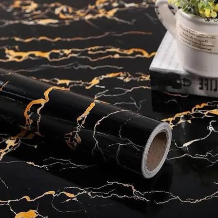 Black marble self-adhesive wallpaper applied on kitchen countertop