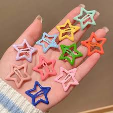 Girl wearing colorful star shape hair clips in bun hairstyle