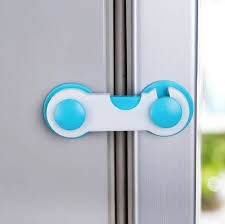 Blue child safety cabinet lock on refrigerator door