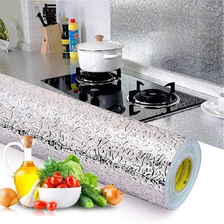 Aluminum foil kitchen wall sticker applied behind stove